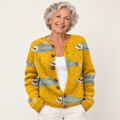 Anouk | Golden Knit Cardigan with Fish Print and Round Buttons worn by a mature woman on a clean background