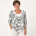 Violette Black-and-White Graphic Cardigan worn by a mature woman on a clean studio background
