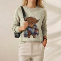 Susan – Cream Jumper with Highland Cow Pattern