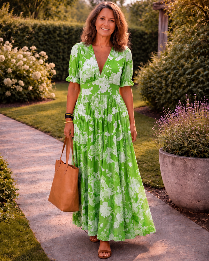 Ione | Korte mouwloze V-hals bloemenprint midi-jurk