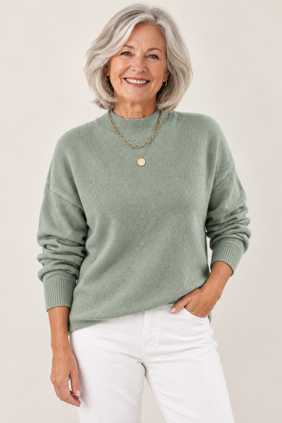 Arabella sage green jumper on a mature model