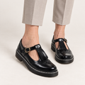 Sofia fringed Mary Jane shoes in Black worn close-up