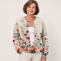 Sabrina | Ribbed Knit Cardigan with Cascading Floral Buttons worn by a mature woman on a clean background