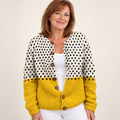 Junella | Colourful Polka Dot Knit Cardigan with Wooden Buttons worn by a mature woman on a clean background