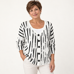 Violette Black-and-White Graphic Cardigan worn by a mature woman on a clean studio background