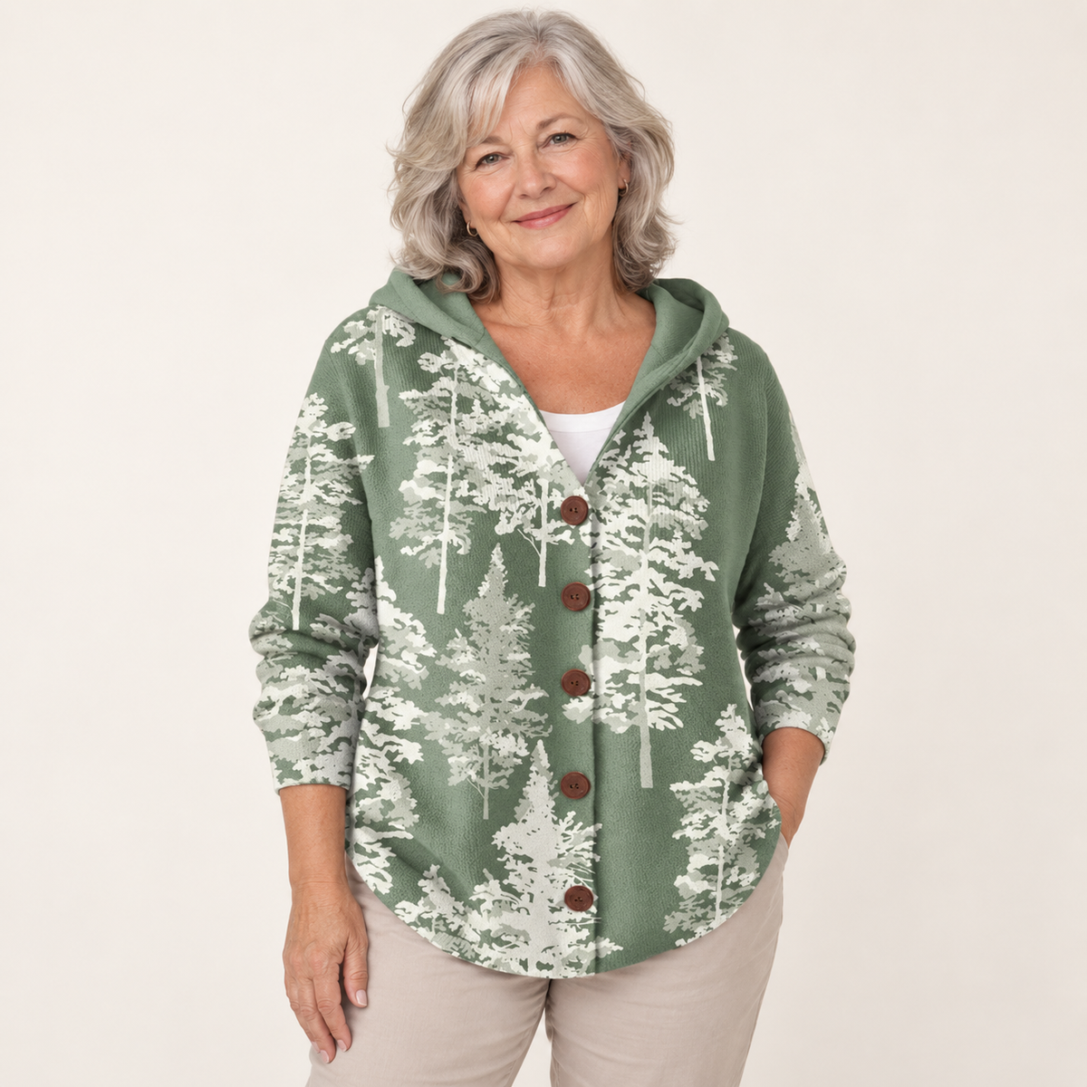 Jacinthe Sage Forest Hooded Cardigan worn by a mature woman on a clean studio background