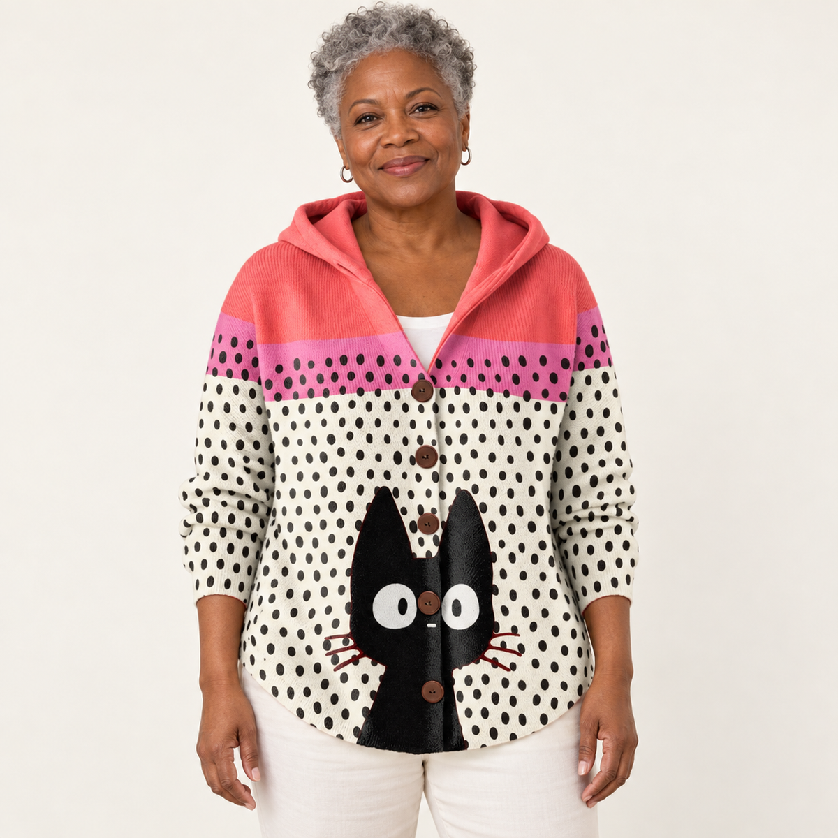 Noémie Pop-Art Cat Hooded Cardigan worn by a mature woman on a clean studio background
