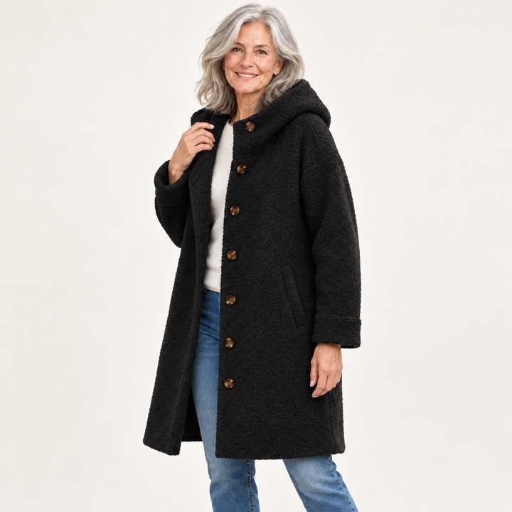 Black hooded coat on mature model