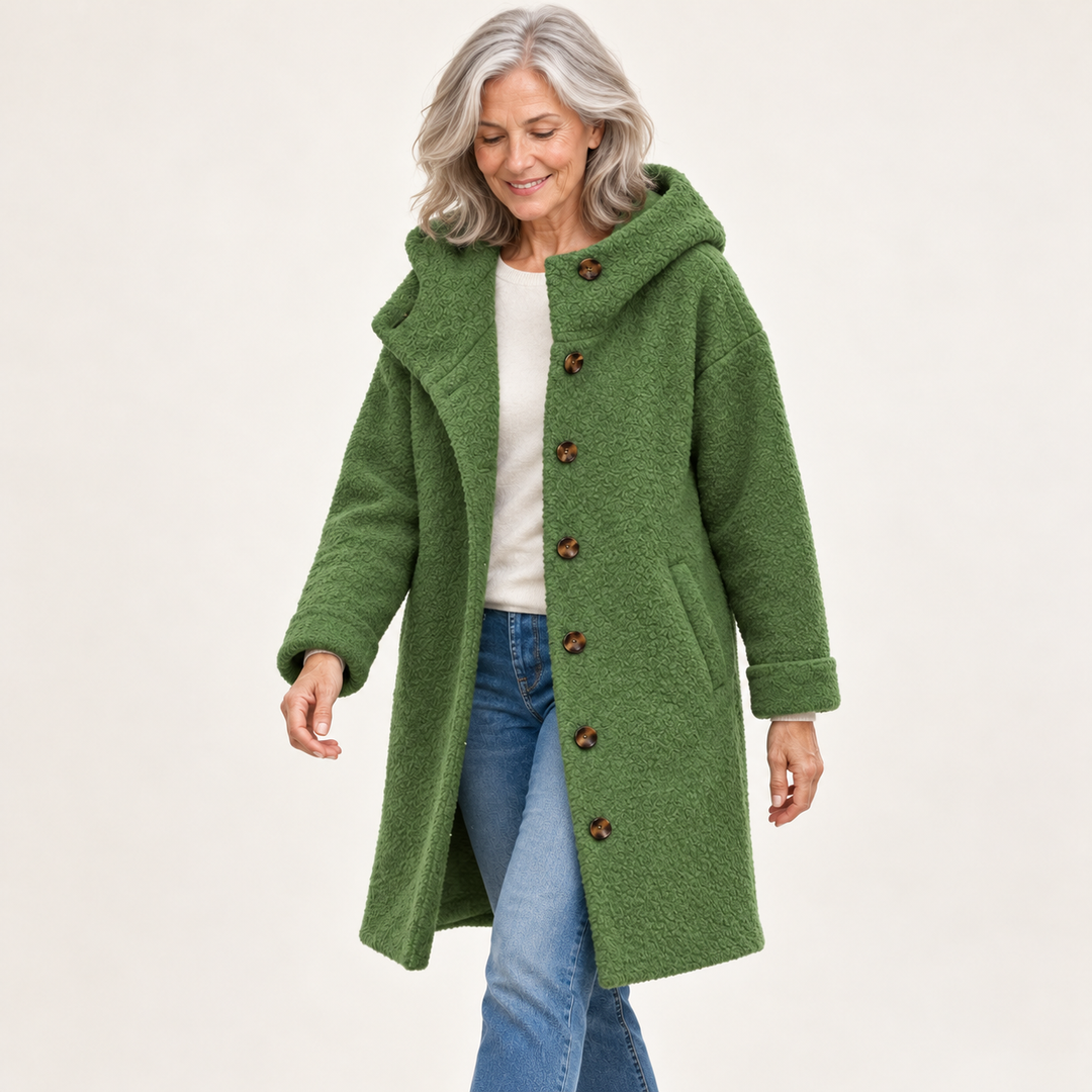 Green hooded coat on mature model