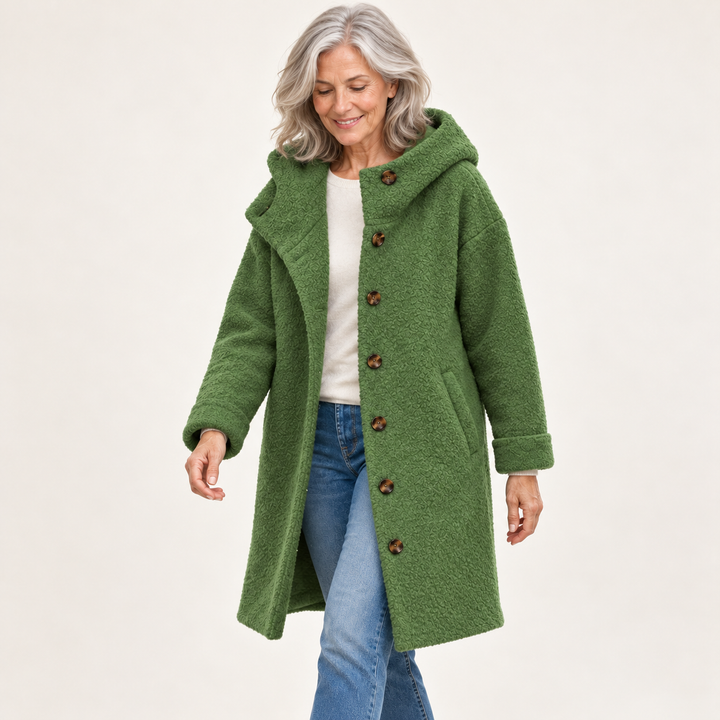 Green hooded coat on mature model
