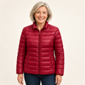 Ulla transitional padded jacket in Dark Red worn by a mature woman, front view