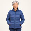 Ulla transitional padded jacket in Indigo worn by a mature woman, front view