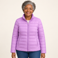 Ulla transitional padded jacket in Lilac worn by a mature woman, front view